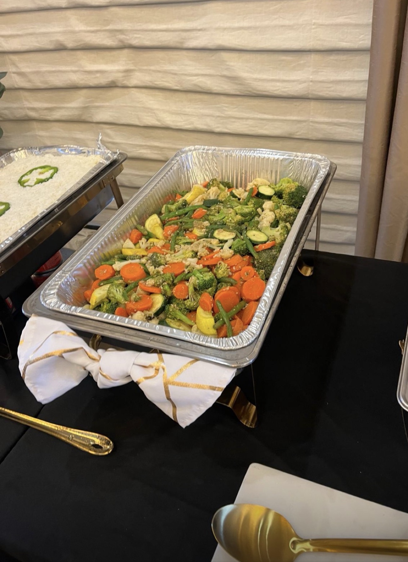 Buffet pan of garden vegetable medley with carrots, broccoli and zucchini