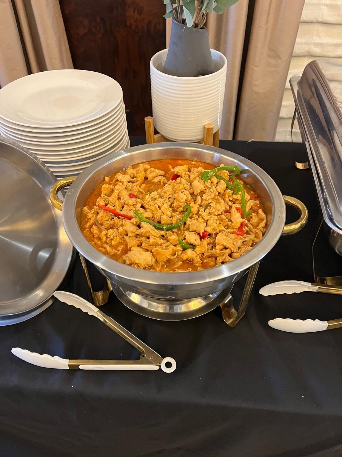 Stew conch served buffet-style in a chafing dish