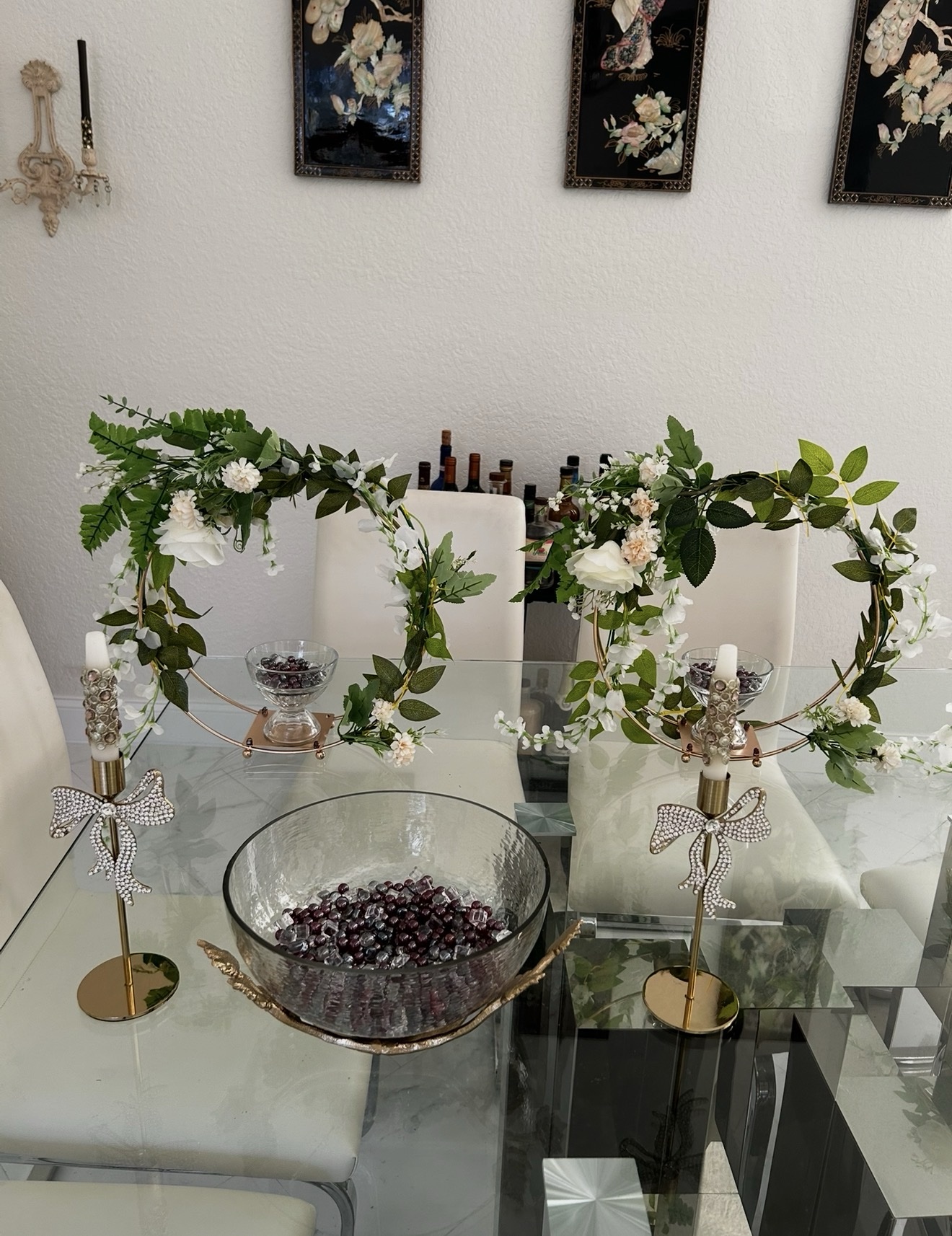 White table setting decorated with floral hoop centerpieces
